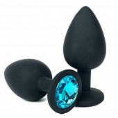 Черная силиконовая анальная пробка с голубым стразом - 8 см.