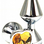 Серебристая анальная пробка с оранжевым кристаллом-сердцем - 8 см.