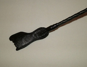
Чёрный стек с плетеной ручкой и наконечником-ступнёй - 70 см. фото в интим магазине Love Boat