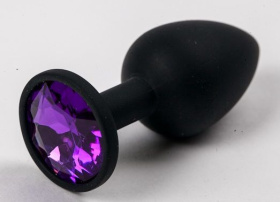 
Черная силиконовая анальная пробка с фиолетовым стразом - 7,1 см. фото в интим магазине Love Boat