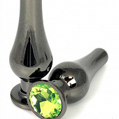 Черная удлиненная анальная пробка с салатовым кристаллом - 8 см.