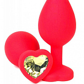 Красная анальная пробка с желтым стразом-сердцем - 10,5 см.