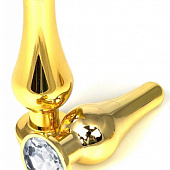 Золотистая удлиненная анальная пробка с прозрачным кристаллом - 10 см.