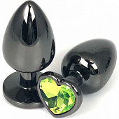 Черная металлическая анальная пробка с салатовым стразом-сердечком - 6,5 см.
