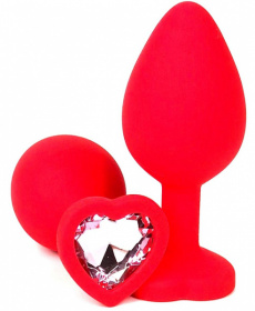 Красная силиконовая анальная пробка с нежно-розовым стразом-сердцем - 10,5 см. фото в интим магазине Love Boat