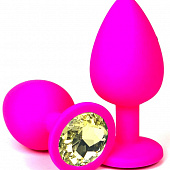 Розовая силиконовая пробка с желтым кристаллом - 6,8 см.