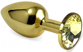 Золотистая анальная пробка с желтым кристаллом - 5,5 см. фото в интим магазине Love Boat